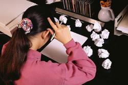 A student struggles with a writing assignment