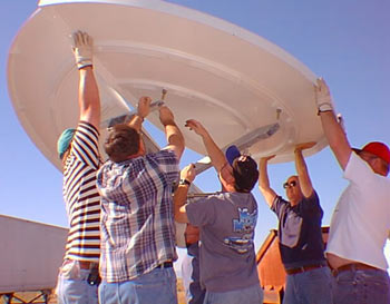 Installing dish for USGS seismic network
