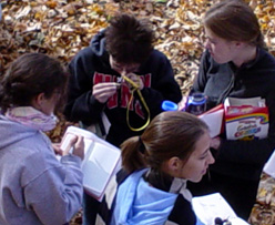 GEO 110 students discuss their findings in the field