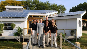 Students from the University of Colorado pose in front of their solar house
