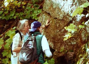 Mary Savina and a student investigate an outcrop